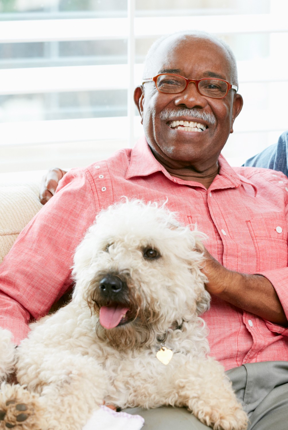 Man with fluffy white dog